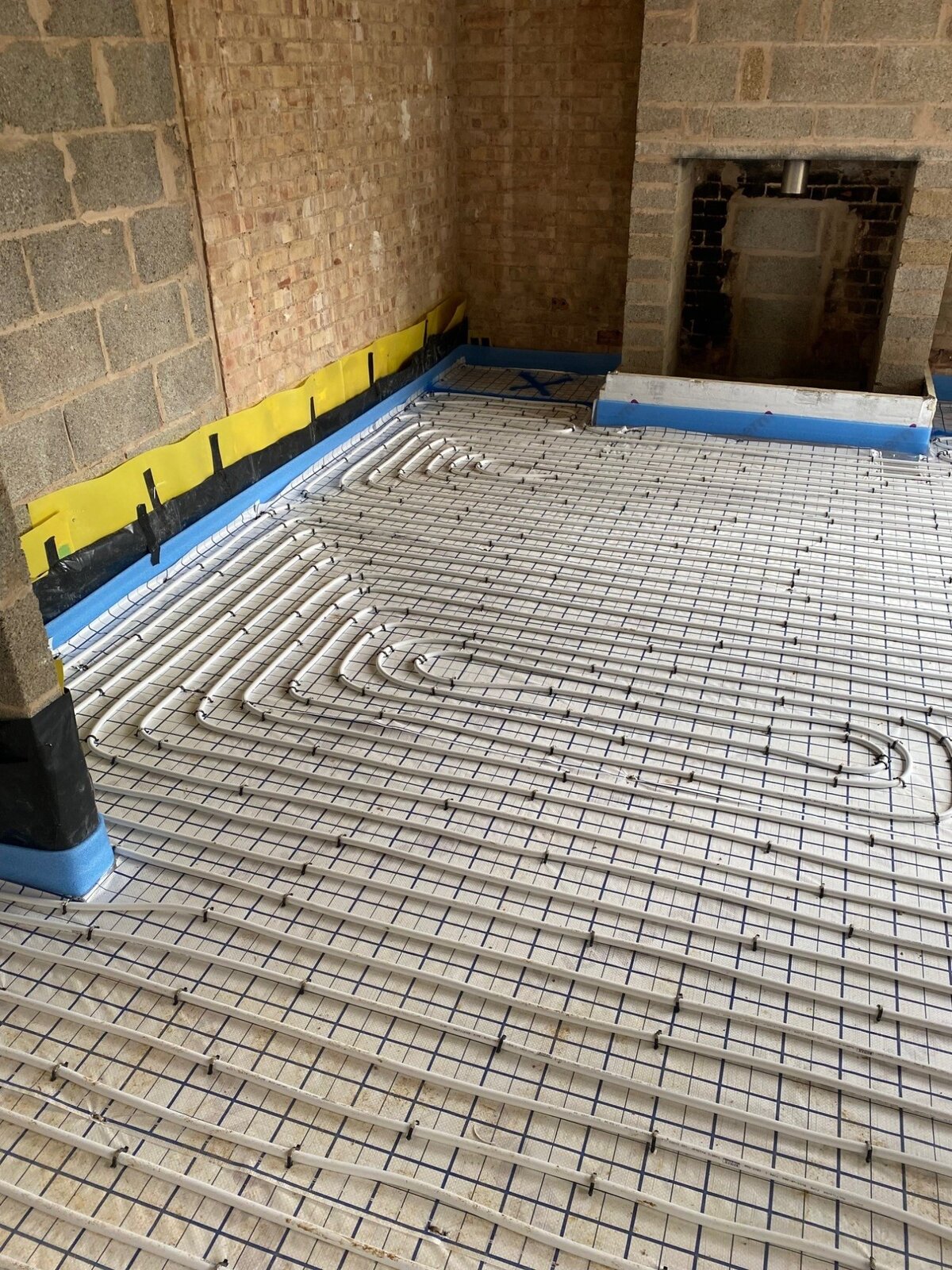 Underfloor heating pipes on insulation board
