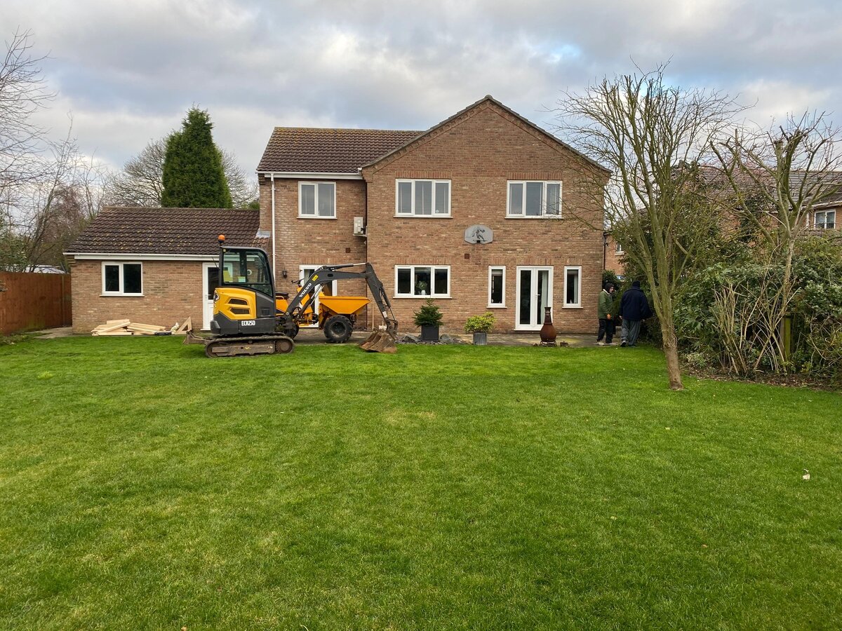Excavator on site day one before extension work began