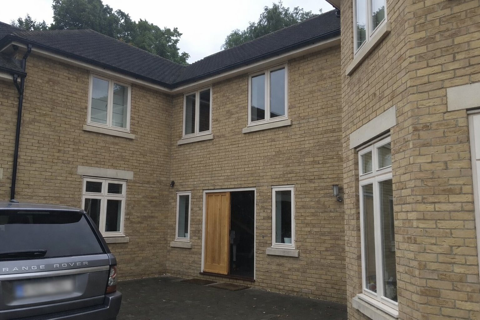 Property before major renovation with original white windows