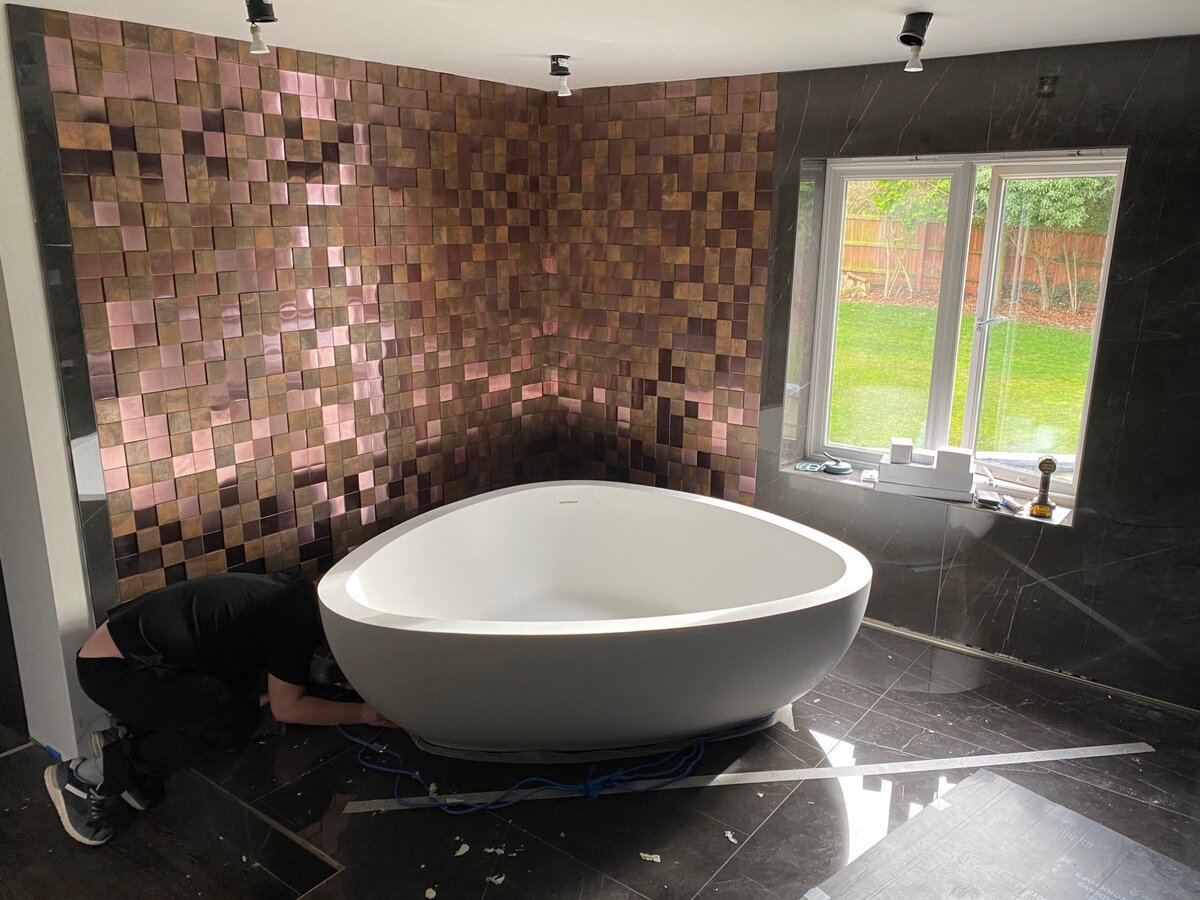 Feature bathroom copper mosaic feature wall corner close up