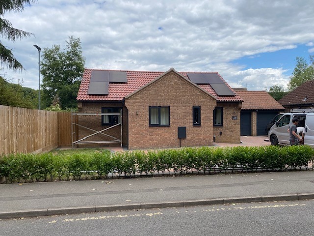 Bungalow with solar PV array installed across roof