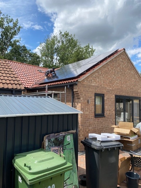Solar panels being installed on roof